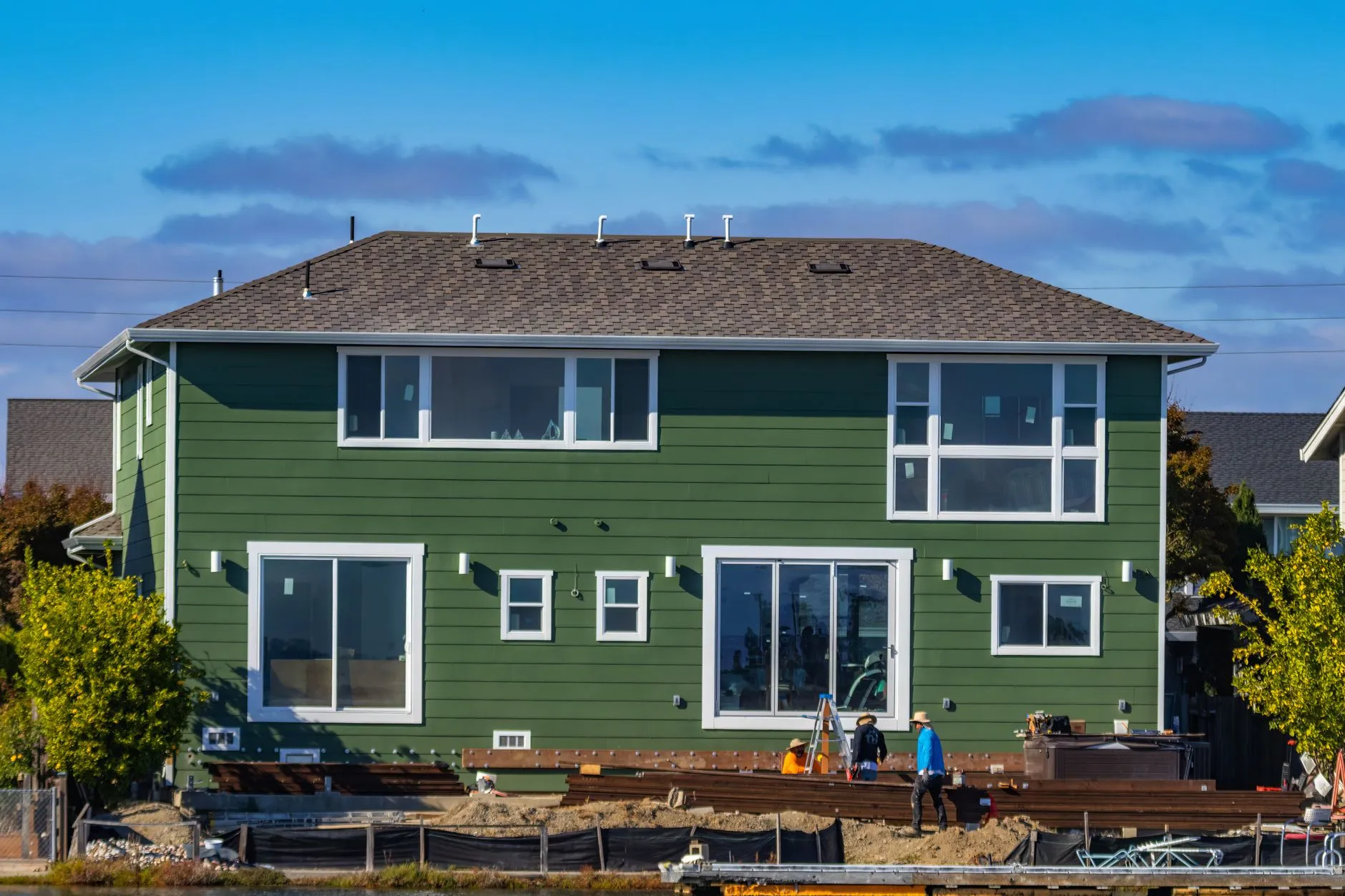 Siding panels being installed on a residential exterior