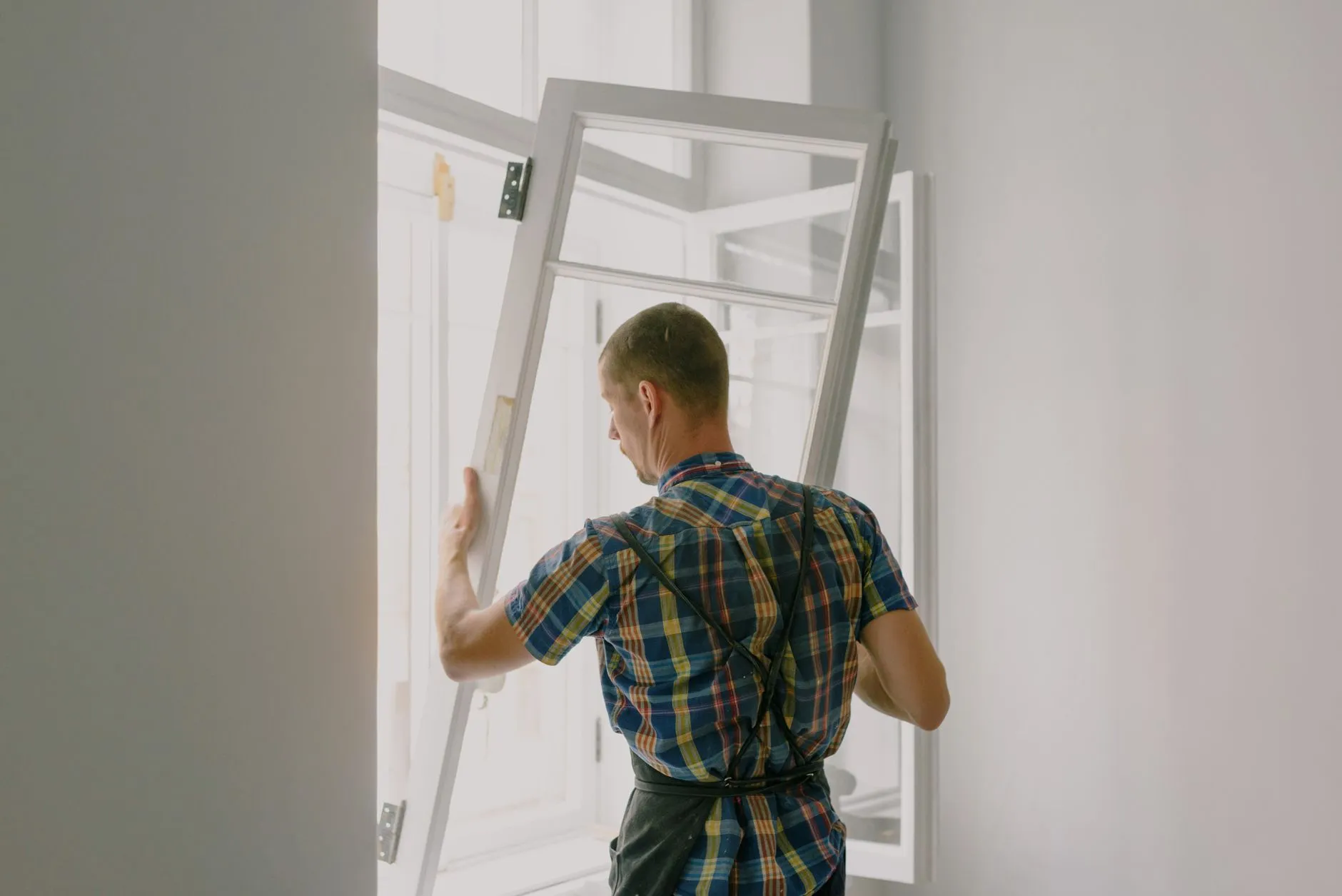 A new residential window unit being fitted